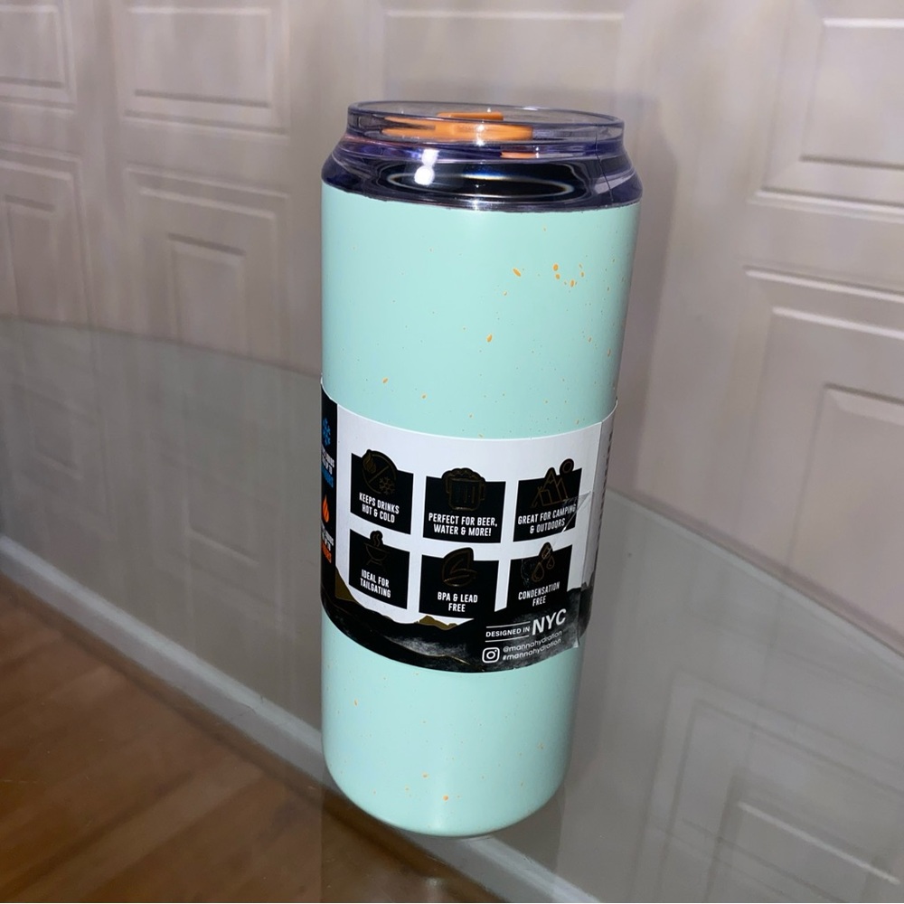Brand New 18Oz, Tall Boy Manna Black Steinless Steel Tumble.Light green/orange